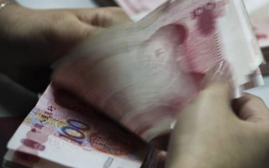 China may deflect pressure with smaller surplus