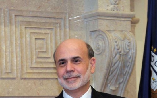 Bernanke: Fed to improve financial oversight