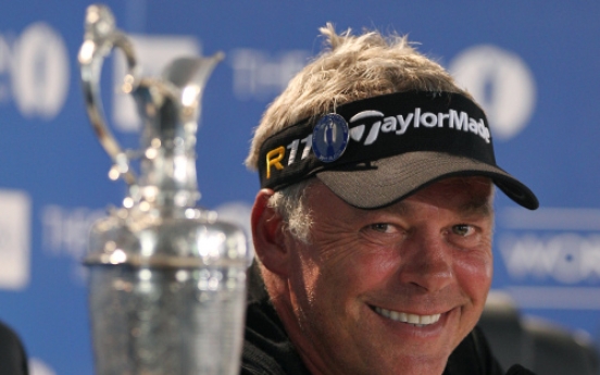 Clarke holds nerve to seal British Open triumph