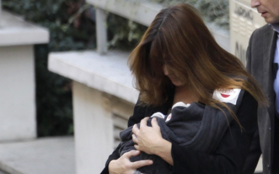 French first lady takes new baby girl home