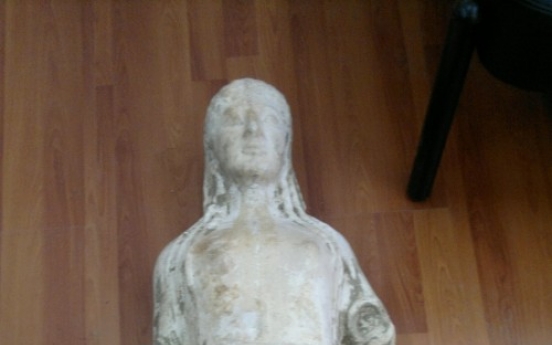 Greek police recover ancient statue from goat pen