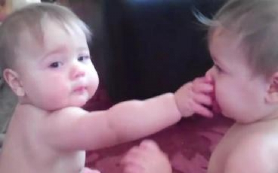 Twin sisters’ squabble over single pacifier becomes huge hit online