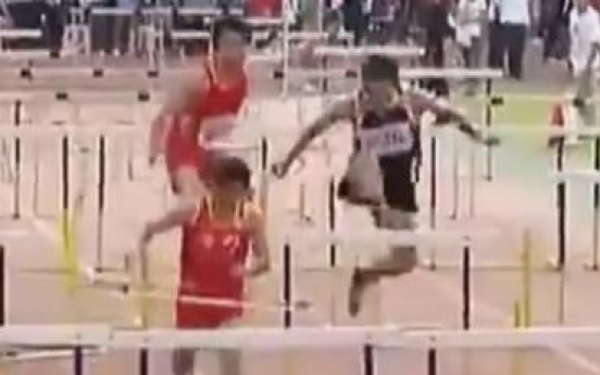Overenthusiastic athlete ‘destroys’ every single hurdle during race