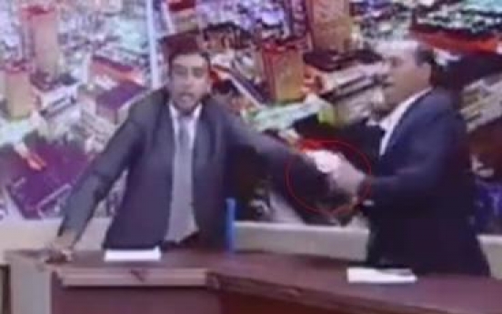 Jordanian lawmaker pulls out gun during TV debate