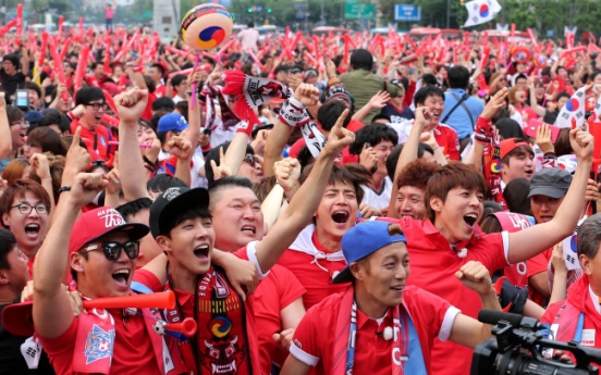 [World Cup] Wave of fans in red shirts fills streets to cheer for Korea