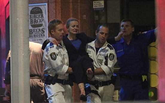 Gunman, 2 hostages killed as police storm Sydney siege cafe