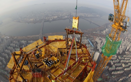Lotte celebrates topping-out of Korea’s tallest building