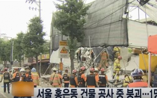 One person buried under collapsed building: report