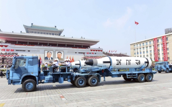 China defends N. Korea trade after its trucks haul missiles