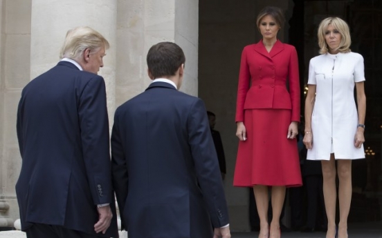 Trump caught on tape complimenting  Macron's wife's body