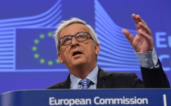 Juncker urges strong German government after Merkel vote wobble