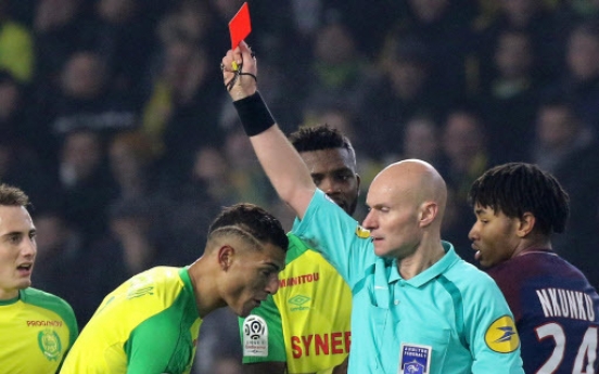 France suspends referee who kicked player