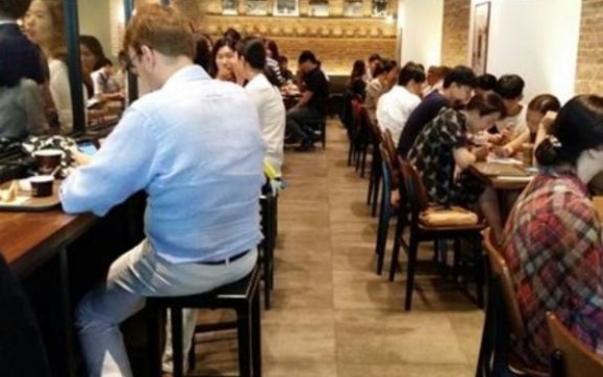 Storm in a teacup? Tempers flare online over coffee shop ‘beggars’