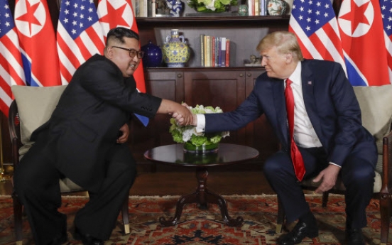 [US-NK Summit] Tensions then smiles as Kim and Trump reach hands across history