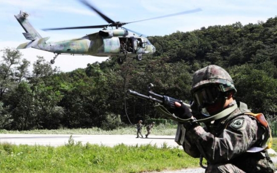 Korea halts its own military drill amid dialogue mood