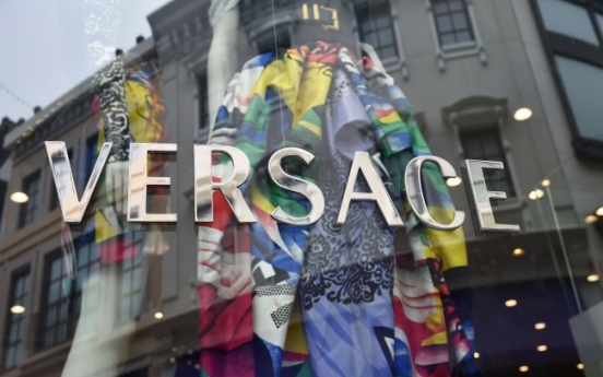 Michael Kors ups the glamour, buys Versace for $2 billion