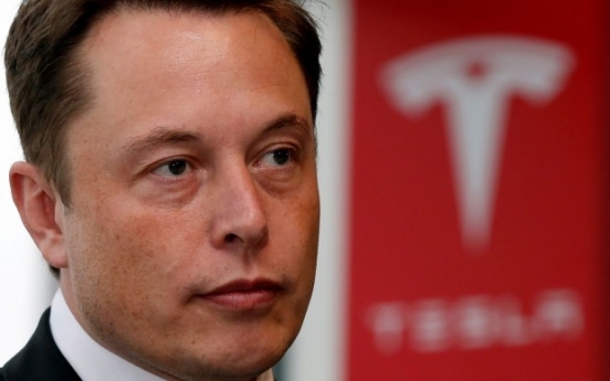 Tesla shares surge in premarket trading