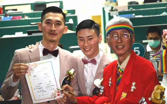 Taiwan holds first gay marriages in historic day for Asia