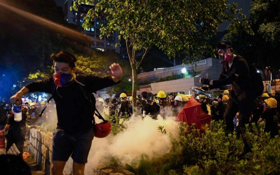 Hong Kong mops up after weekend of violence, braces for more protests