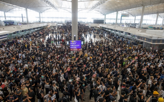Flights resume at Hong Kong airport after protests