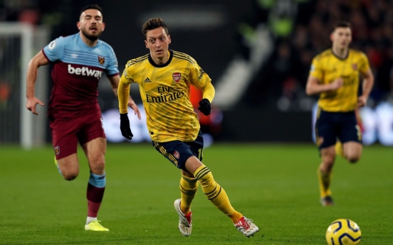 China says Arsenal's Ozil 'deceived by fake news'
