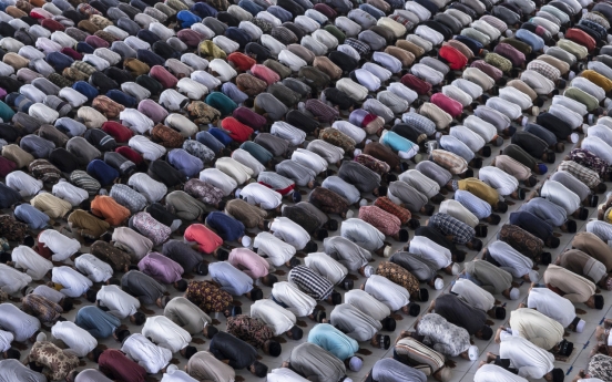 Muslims begin marking a subdued Ramadan under virus closures