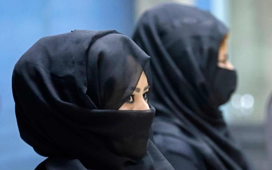 Taliban say will allow women at universities, but mixed classes banned