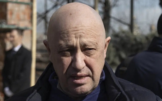 The mercenary chief who urged an uprising against Russia's generals has long ties to Putin