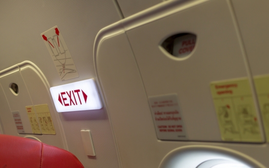 Airplane emergency exit seats to be assigned to uniformed personnel first