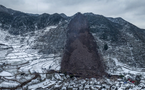 Landslide in China buries 47 people in freezing temperatures and snow