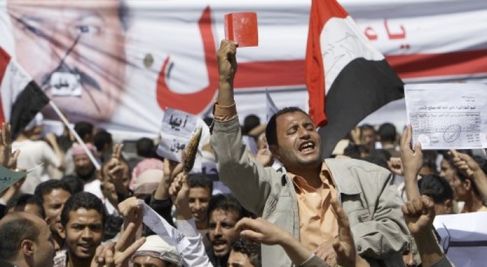 Yemeni president digs in as protests spread