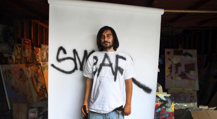 Graffiti artist puts tagging behind him