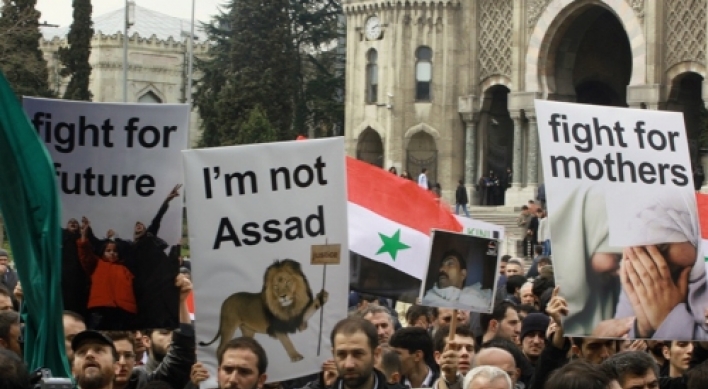 Syria lifts hated law, but protesters unimpressed