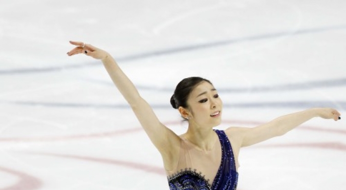 S. Korean Kim Yu-na tops short program at world figure championships