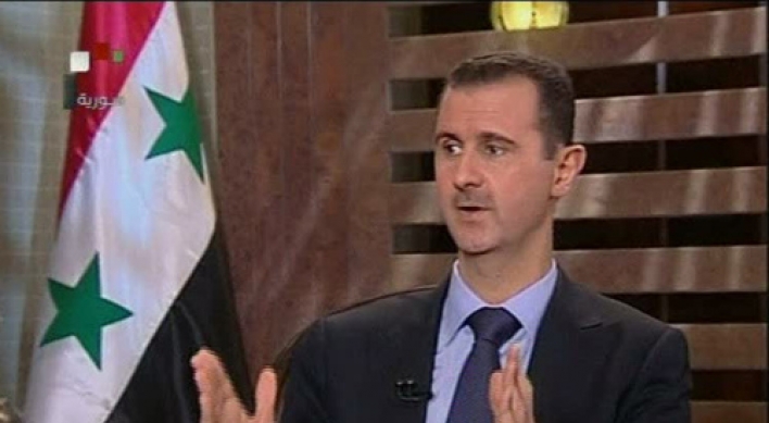 Assad warns against foreign intervention