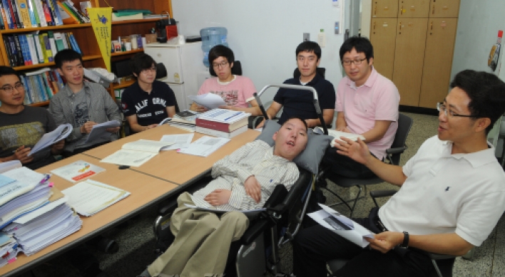 Wheelchair-bound young researcher’s passionate life