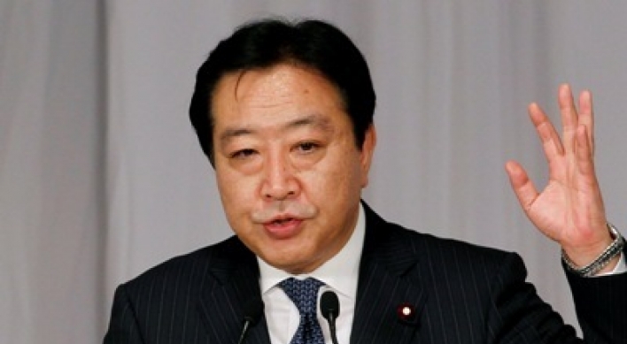 Finance minister wins Japan party vote, to be P.M.