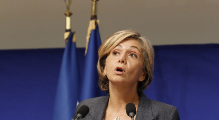 France unveils slashed budget