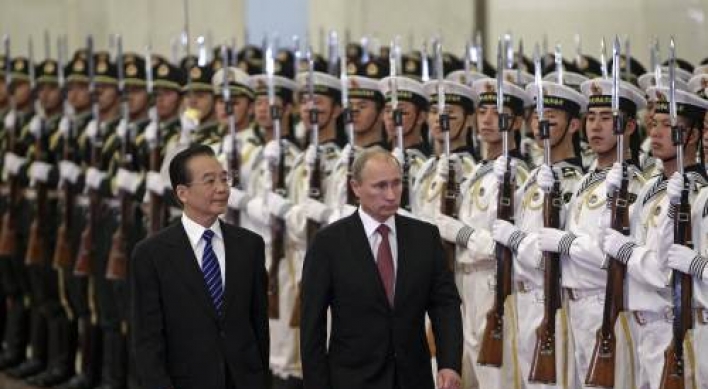 Russian PM Putin in China seeking closer ties