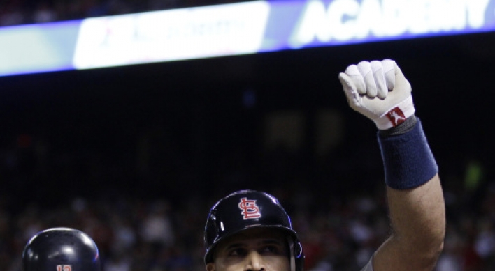 Pujols buries Rangers with three homers