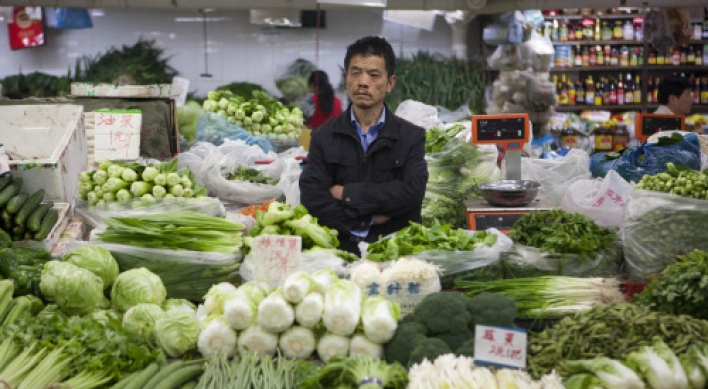 China’s inflation falls as food prices cool