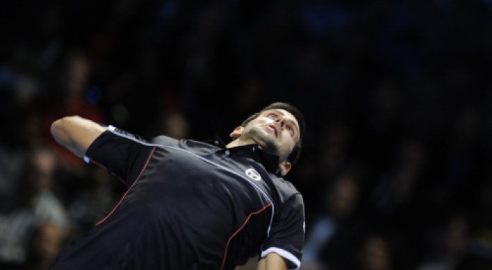 Ferrer stuns tired Djokovic at ATP Finals
