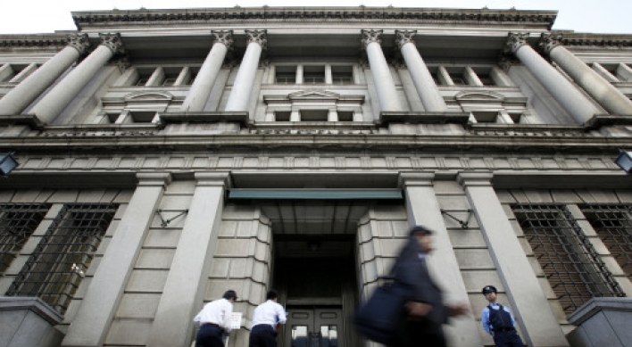 BoJ cuts economic view for second month