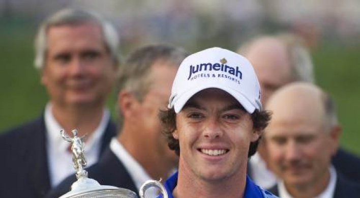 Clarke, McIlroy honored by Queen after major wins