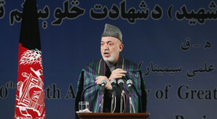 Karzai condemns video of urination on corpses