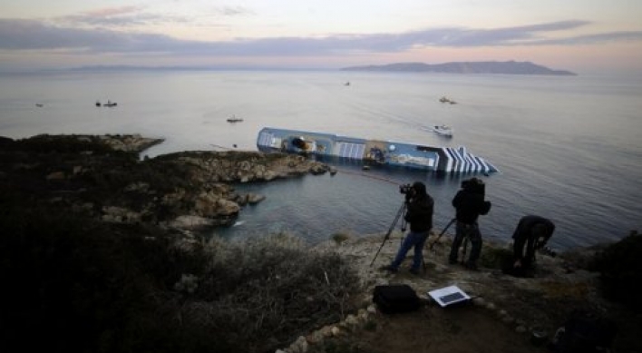 Italy captain denies abandoning ship as toll rises to 11