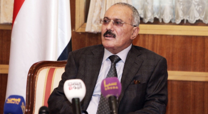 Saleh out, Yemenis remain cautious