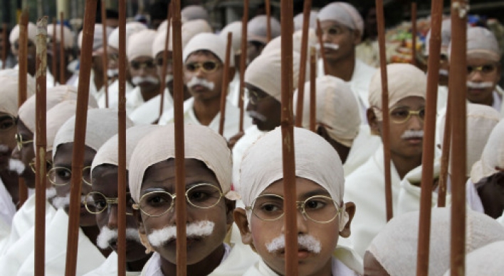 Underprivileged Indian children rally in Gandhi costumes