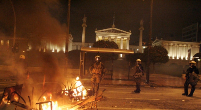 Greece passes austerity deal amid rioting