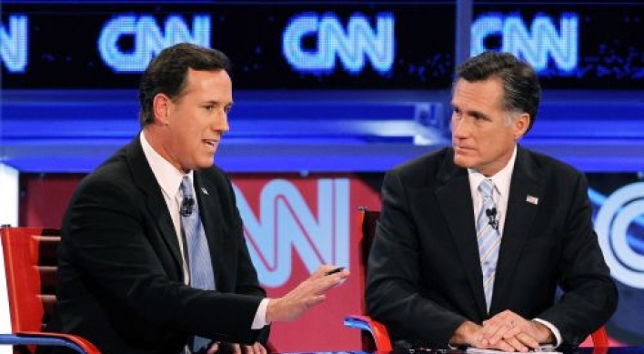 Romney pounces on Santorum in 20th debate